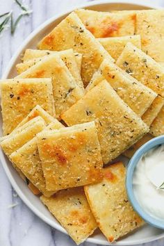 low carb cheese crackers on a plate with ranch dip