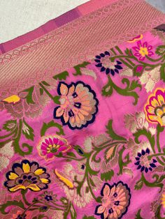 Paithani Style Floral Semi Banarasi Silk Dupatta. Meenakari Work with gold Zari Work. Handloom Dupatta, very light weight and soft. Item: DupattaBase color : Baby Pink Fabric : Banarasi Semi Soft Silk (Not Pure Silk)Work : Weaved with tasselsLength of the Dupatta : 88 inches approx.Width of the dupatta : 35inches (Approx.)Please note there are threads on the back side of the dupatta. Store Policies- No return or exchange will be accepted for color variations.- No return or exchange will be accep Pink Meenakari Lehenga For Puja, Pink Meenakari Traditional Wear For Eid, Pink Traditional Wear With Meenakari For Eid, Pink Paithani Silk Traditional Wear With Patterns, Pink Paithani Silk Traditional Wear With Traditional Patterns, Pink Katan Silk Traditional Wear, Pink Traditional Wear With Paithani Silk And Traditional Patterns, Pink Meenakari Lehenga In Paithani Silk, Pink Paithani Silk Traditional Wear For Eid