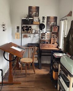 a room filled with wooden furniture and lots of clutter on the wall next to a window