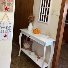 the entry way to a home decorated for halloween with decorations and signs on the wall