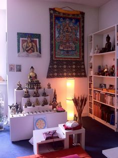 a living room filled with lots of different types of decorations and decor on the walls