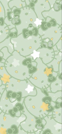 a green and yellow wallpaper with stars on it