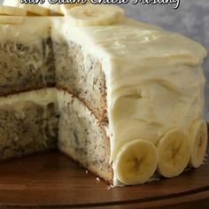 there is a cake with bananas on the top and one slice cut out from it