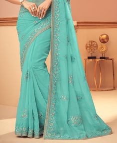 Aquamarine Blue Designer Embroidered Silk Wedding Saree-Saira's Boutique Elegant Blue Saree With Intricate Embroidery, Blue Blouse Piece With Floral Embroidery For Wedding, Blue Floral Embroidered Blouse Piece For Wedding, Fitted Floor-length Blue Embroidered Fabric, Formal Blue Saree With Resham Embroidery, Blue Saree With Floral Embroidery For Reception, Blue Floral Embroidered Saree For Reception, Formal Blue Embroidered Lehenga, Elegant Blue Embroidered Fabric For Designer Wear