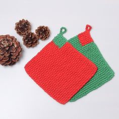 crocheted christmas stocking with pine cones on the side and two small bags