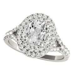 an oval cut diamond ring with double halos