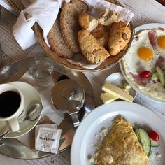 an assortment of breakfast foods and drinks on a table