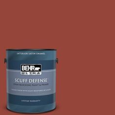 the behr ultra stain - blocking paint and primer in one is shown on a green