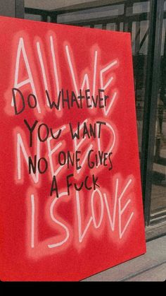 a red sign that says do whatever you want, no one gives a sick heart