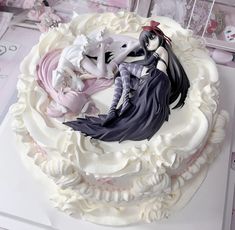 there is a cake decorated with anime characters on it