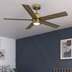 a ceiling fan in a bedroom with blue walls