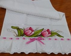 a white apron with pink tulips on it