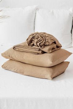 three pillows stacked on top of each other