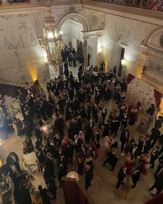 a large group of people standing in a room