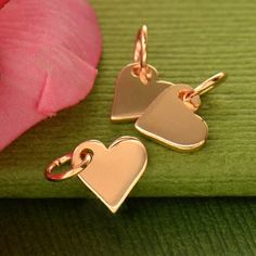 Tiny Heart Dangle. This tiny heart charm will make the perfect finishing touch on your necklace and bracelet designs. *Bronze is an alloy that consists of a mixture of copper and tin, approximately 90% copper and 10% tin. Our natural bronze styles are solid bronze.*Our vermeil style gold plate is 40 micro inches of 98.5% pure gold plated over sterling silver with a fine layer of nickel in between. Available in Bronze, Sterling Silver. 14K Gold Plated, 24K Gold Plated, 14K Solid Gold Measurements New Mommy Gifts, Bridal Party Jewelry, Mommy Gift, Rose Gold Charms, Monogram Jewelry, Rose Gold Heart, Gold Baby, Tiny Heart, Small Heart