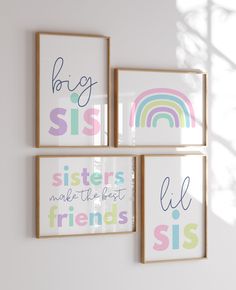 three framed pictures hanging on the wall with rainbows and words in them, one saying big sis sisters make the best friends