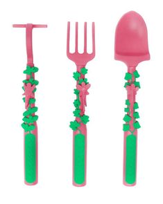 three plastic utensils with green and pink decorations