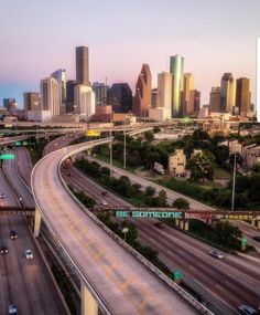 an aerial view of the city skyline and freeway