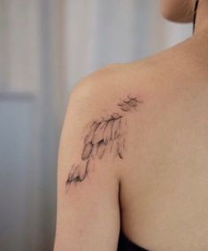 a woman with a tattoo on her shoulder