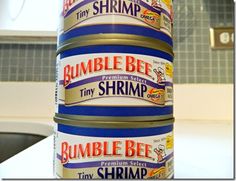 a stack of tins sitting on top of a kitchen counter