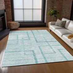 a living room with a couch, chair and rug