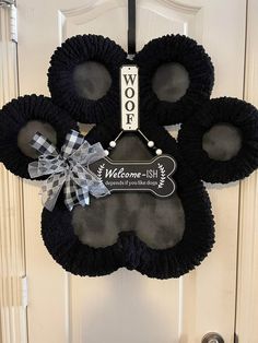 mickey mouse door hanger with welcome to the world sign on it's front