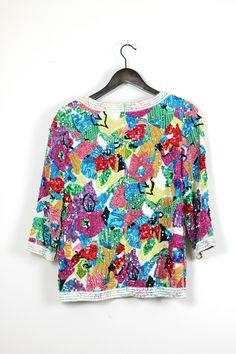 "Isn't this fun?? A beautifully beaded sequined top!! Love this! Excellent condition! Measuring: 22\" length Width: 40\" Great 3/4 sleeves Pet Free/smoke free Enjoy! Great for the holidays!" Fall Multicolor Embellished Tops, Multicolor Sequin Tops For Fall, Spring Multicolor Sequined Blouse, Multicolor Sequin Blouse For Spring, Embellished Multicolor Party Blouse, Multicolor Embellished Blouse For Party, Embellished Multicolor Blouse For Party, Fitted Multicolor Embellished Blouse, Multicolor Fitted Tops With 3/4 Sleeves