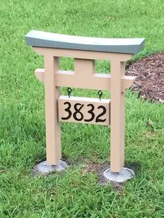 a small wooden bench sitting in the grass