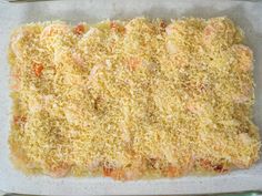 a casserole dish with carrots and parmesan cheese