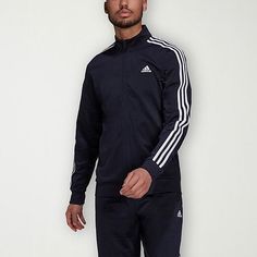 This adidas men's midweight track jacket is a lounging and workout essential. Crafted from tricot, this classic-fit jacket features the brand's signature striped design and has a mock neck, zip closure, and side pockets. Style with jogger pants or workout shorts. Closure Type: ZipperFit: Classic FitNeckline: Mock NeckPockets: 2 Side Slip PocketsSleeve Length: Long SleeveWarmth Factor: MidweightOuterwear Length: MidFiber Content: 100% PolyesterFabric Description: TricotCoat Style: Track JacketsCa Adidas Moisture-wicking Track Jacket, Adidas Long Sleeve Activewear For Training, Adidas Moisture-wicking Sportswear Track Jacket, Adidas Sporty Track Jacket For Training, Adidas Long Sleeve Track Jacket For Training, Adidas Training Track Jacket, Functional Track Jacket With Three Stripes For Sports Season, Adidas Moisture-wicking Track Jacket For Training, Adidas Casual Track Jacket For Training