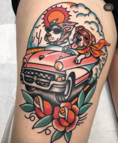 a woman's thigh with an old school style car and dog tattoo on it