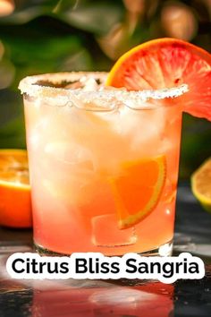 a close up of a drink with an orange slice on the rim and text that reads citrus bliss sangria