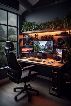 a computer desk with two monitors on it in front of a large window and some potted plants