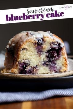 a blueberry bundt cake with icing on a plate