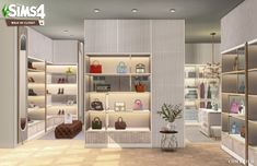 a room filled with lots of white shelves covered in purses and handbag's