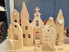 several wooden houses and trees on a table