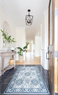 the hallway is clean and ready for us to use as an entrance way in this home