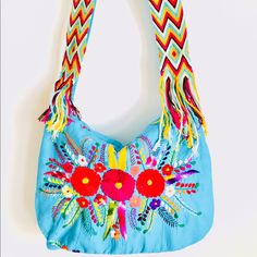 Mexican Bag Embroidered Boho Chic Indie Messenger Crossbody Color: Turquoise And Colorful Indigenous Hand Embroidery Loomed Handmade Colorful Belt High Quality Seams Closes With A Zipper. Comfortable Wide Strap, Which Is Perfect For Traveling A Roatrip, A Holiday Day At The Beach, Books, Colors, Notebook, Water, Food, Very Spacious And Useful From Groceries To A Laptop, Pieces Are Handmade And Color Unique Embroidering Adds To The Unique Beauty Of Garment. Handmade With Love, Aida Coronado Blue Embroidered Bag For Everyday Use, Blue Embroidered Bags For Everyday Use, Embroidered Blue Rectangular Shoulder Bag, Embroidered Blue Bag, Everyday Blue Embroidered Bags, Rectangular Blue Embroidered Shoulder Bag, Blue Tote Hobo Bag For Festivals, Blue Tote Shoulder Bag For Festivals, Bohemian Blue Hobo Tote Bag