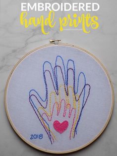 embroideryed handprints on a white background with text overlay