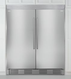 a large stainless steel double door refrigerator in a kitchen with white walls and flooring