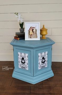 a small blue table with pictures on it