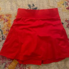 Red Tennis Skirt With Back Pocket And Built In Shorts!! Red Short Skort With Built-in Shorts, Red Skirted Bottoms For Summer, Red Elastic Waistband Mini Skirt For Summer, Red High Waist Skirt With Elastic Band, Red High Waist Skirt With Elastic Waistband, Red High-waist Skirt With Elastic Waistband, High Waist Red Skirt With Elastic Waistband, Red Stretch High Waist Mini Skirt, Red High Waist Stretch Mini Skirt