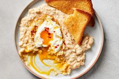 a plate with toast, eggs and mashed potatoes on it