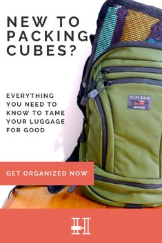 a green backpack sitting on top of a wooden table next to an orange and white sign that reads, new to packing cubes? everything you need to know to tame your luggage