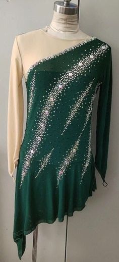 a green and white top with sequins on it