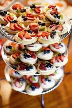 three tiered trays filled with different types of pastries