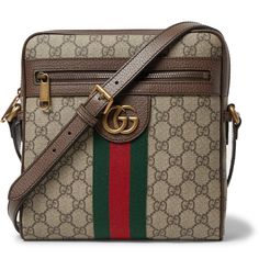 This leather-trimmed 'Ophidia' bag combines Gucci's most recognisable signatures, not only is it made from 'Supreme' coated-canvas, it's also detailed with a gold-tone 'GG' emblem and striped webbing. Slim and comfortable to carry, it's been crafted in Italy and has pockets for your cash and cards. Wear it with: Gucci Shirt, Vetements Coat, SAINT LAURENT Jeans. Gucci Rectangular Bag With Gold-tone Hardware, Rectangular Monogram Canvas Shoulder Bag With Gold-tone Hardware, Designer Gucci Pouch Bag, Gucci Pouch Bag With Detachable Strap, Designer Gucci Shoulder Satchel, Gucci Shoulder Bag In Signature Coated Canvas For Everyday, High-end Formal Shoulder Bag In Signature Coated Canvas, Luxury Formal Bags In Signature Coated Canvas, Rectangular Bags With Removable Pouch In Signature Coated Canvas