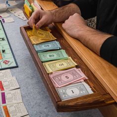 a man is playing monopoly on the table