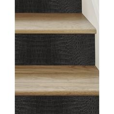 an image of a set of stairs that are made of wood and black alligator skin