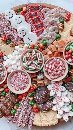 a platter filled with lots of different types of holiday treats on top of a table